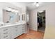 Bright bathroom boasts double vanity, walk-in closet, and wood floors at 1318 Moreland Dr # 108, Clearwater, FL 33764