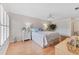 Well-lit bedroom with wood floors, closet, and large window at 1318 Moreland Dr # 108, Clearwater, FL 33764