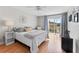 Cozy bedroom with a queen bed and sliding glass door to the patio at 1318 Moreland Dr # 108, Clearwater, FL 33764