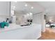 Bright kitchen with white cabinets and countertops, featuring a breakfast bar at 1318 Moreland Dr # 108, Clearwater, FL 33764
