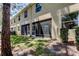 Home exterior featuring a screened in porch, mature tree, and well-maintained lawn at 13217 Canopy Creek Dr, Tampa, FL 33625