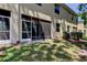 Home exterior featuring a screened in porch, mature tree, and well-maintained lawn at 13217 Canopy Creek Dr, Tampa, FL 33625