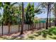 Secluded backyard featuring mature landscaping and a secure black metal fence for privacy and security at 13217 Canopy Creek Dr, Tampa, FL 33625