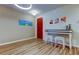 Welcoming entryway with a red door, console table, and bright, modern decor and flooring at 13217 Canopy Creek Dr, Tampa, FL 33625