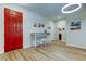 Bright entryway with a vibrant red door, stylish console table, and access to other rooms at 13217 Canopy Creek Dr, Tampa, FL 33625