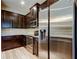 Gourmet kitchen boasting stainless steel appliances, dark cabinets, and granite countertops at 13217 Canopy Creek Dr, Tampa, FL 33625