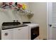 Laundry room with front load washer and dryer at 13217 Canopy Creek Dr, Tampa, FL 33625