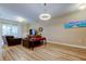 Spacious living room with plenty of seating, natural light, and a stylish interior design at 13217 Canopy Creek Dr, Tampa, FL 33625