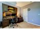 Well-appointed home office with a built-in desk, shelving, and dual monitor setup, perfect for remote work at 13217 Canopy Creek Dr, Tampa, FL 33625