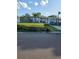 Charming single-story home featuring a well-maintained lawn, palm tree, and inviting front porch at 1329 Tuscola St, Clearwater, FL 33756