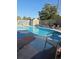 Backyard in-ground pool surrounded by lounge chairs and a shed, great for outdoor relaxation at 1329 Tuscola St, Clearwater, FL 33756