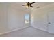 Clean bedroom featuring neutral carpet, and bright window at 14807 Capps Estates Ln, Wimauma, FL 33598