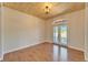 Bedroom featuring wood floors, wooden ceiling and natural light from large windows at 14807 Capps Estates Ln, Wimauma, FL 33598