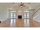 Hardwood floors and a fireplace highlight this spacious living room at 14807 Capps Estates Ln, Wimauma, FL 33598