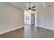 Spacious main bedroom featuring tile floors and natural light from large windows at 14807 Capps Estates Ln, Wimauma, FL 33598