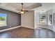 Spacious main bedroom featuring tile floors and natural light from large windows at 14807 Capps Estates Ln, Wimauma, FL 33598