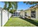The home has a spacious backyard with a screened-in pool and well-maintained lawn at 15018 Greeley Dr, Tampa, FL 33625