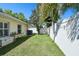 Lush backyard with well-maintained lawn and a sturdy privacy fence offering seclusion at 15018 Greeley Dr, Tampa, FL 33625
