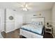 Comfortable bedroom featuring a white wood bed frame, and warm hardwood floors at 15018 Greeley Dr, Tampa, FL 33625