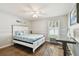 Bedroom showcasing modern decor, wood floors, and natural light at 15018 Greeley Dr, Tampa, FL 33625