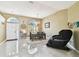 Dining area with tile floors, modern chandelier, views of the front yard and home decor at 15018 Greeley Dr, Tampa, FL 33625