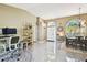 Spacious open concept living room into dining room featuring tile flooring and neutral walls at 15018 Greeley Dr, Tampa, FL 33625
