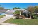 Charming single-story home with well-manicured landscaping, a two-car garage, and a welcoming entryway at 15018 Greeley Dr, Tampa, FL 33625