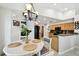 Eat-in kitchen features wood cabinets, black appliances, and eat-in table at 15018 Greeley Dr, Tampa, FL 33625