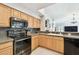 Beautiful kitchen featuring updated appliances, a spacious countertop, and sleek cabinetry at 15018 Greeley Dr, Tampa, FL 33625