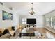 Bright living room with hard wood floors and large windows at 15018 Greeley Dr, Tampa, FL 33625