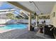 Inviting screened-in pool area with comfortable seating, perfect for outdoor relaxation at 15018 Greeley Dr, Tampa, FL 33625
