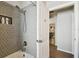 Nicely remodeled walk-in shower features tile and modern shower head at 15018 Greeley Dr, Tampa, FL 33625