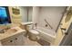 Bathroom with shower and tub combo, white tiled walls and marble counter tops at 1801 Bedford Ln # 46, Sun City Center, FL 33573