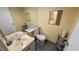 Bathroom with large mirror, small decorative wall shelves and tiled floors at 1801 Bedford Ln # 46, Sun City Center, FL 33573