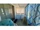View of the laundry room with washer and dryer and sliding glass door at 1801 Bedford Ln # 46, Sun City Center, FL 33573
