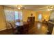 Open concept living area features hardwood floors, calming decor, and an open transition to the other rooms at 1801 Bedford Ln # 46, Sun City Center, FL 33573