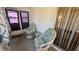 Enclosed patio with comfortable wicker furniture at 1801 Bedford Ln # 46, Sun City Center, FL 33573