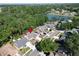 Aerial view of home by a lake in a neighborhood surrounded by trees gives great views and peaceful living at 2033 Shadow Pine Dr, Brandon, FL 33511