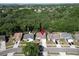 Aerial view of a home nestled among lush trees in a serene neighborhood offers scenic views and peaceful living at 2033 Shadow Pine Dr, Brandon, FL 33511