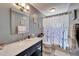 Charming bathroom with large vanity, granite countertop, and shower with modern tile at 2033 Shadow Pine Dr, Brandon, FL 33511