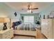 Inviting bedroom with hardwood floors, ceiling fan, and plenty of storage space at 2033 Shadow Pine Dr, Brandon, FL 33511