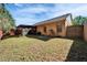Exterior view shows fenced backyard and screened patio providing privacy and outdoor living at 2033 Shadow Pine Dr, Brandon, FL 33511