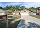 Charming one-story home with a well-manicured lawn and a two-car garage at 2033 Shadow Pine Dr, Brandon, FL 33511