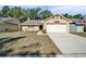 Charming one-story home with a well-manicured lawn and a two-car garage at 2033 Shadow Pine Dr, Brandon, FL 33511
