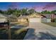 Charming one-story home with a well-manicured lawn and a two-car garage at 2033 Shadow Pine Dr, Brandon, FL 33511