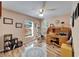 Bright home office with hardwood floors, ceiling fan, and natural light from large windows at 2033 Shadow Pine Dr, Brandon, FL 33511