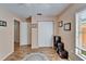 Well-lit home office with hardwood floors, closet, and window with natural light at 2033 Shadow Pine Dr, Brandon, FL 33511