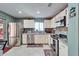 Bright kitchen featuring stainless steel appliances, tile backsplash, and ample counter space at 2033 Shadow Pine Dr, Brandon, FL 33511
