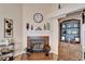 Close-up of fireplace in living room featuring mantel decorations and tile at 2033 Shadow Pine Dr, Brandon, FL 33511