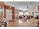 Bright living room boasts wood floors, neutral paint, and comfortable furnishings at 2033 Shadow Pine Dr, Brandon, FL 33511